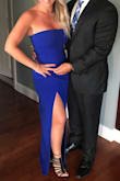 I wore this as a guest to a wedding and loved it! The slit was a bit high but just had to be more conscious of leg position when sitting. The color is amazing, the fit was very flattering, and fortunately my heels were high enough so that I didn't have to get it altered. The material is thick and the quality is outrageous. My husbands words that is my favorite thing you've put on since I met you (aside from your wedding dress).

I HIGHLY recommend this dress. - Nicole A.