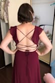 I'm wearing this for an autumn wedding as a bridesmaid and it was requested to wear a long dress. As I'm 4'11 any long dress I was going to buy would need to be altered even with a high to mid heel, so I went in knowing I would probably never find a perfect length (woes of being a short girl). I'm pretty busty so I wanted to make sure I was wearing a dress that would give me good coverage as well as an adjustable waist for any sort of weight fluctuations. The tie back makes the fit more versatile and it's just super flattering! I love it so much. Can't wait to get it altered. It's very feminine and formal so it's perfect for what I needed. - Michele T.