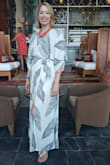 I can't wait to wear this on my upcoming beach trip! This will be good poolside and for dinner. The fit/style is more on the loose side but I am generally a true medium and would not size down. If you're in between sizes, then maybe size down. I am tall and this hits just at the ankle, perfect for flat sandals. The material is soft and breathable but prone to wrinkles but nothing a quick iron can't handle, or hang it up in the bathroom. - Felisia B.