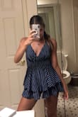 This romper is super cute and the back is really pretty!! Only thing I'd complain about is the length, wish it was a bit longer. - Jenna L.