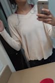 Thos sweater is super cute! I ordered a small im 5'6 116 lbs. It's more of a crop sweater but not short ypu wont see belly button or anything and it's so flowy and cute plan to wear it just with leggings. - Miriam M.