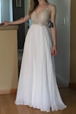 This dress is absolutely gorgeous! Every stitch and bid is nicely done, I haven't noticed any loose elements. Quality and the price are great. I was concerned that it might be see-through but fabric is actually opaque. Dress is long for my height (5'5") so I'll definitely will need alternation. It's gonna be dress for my wedding reception and I can't wait to dance away in it! - Maria R.
