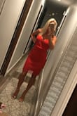 I loved this dress! I wasn't sure what size I would have been so I ordered XS(in pink) and S(in red). I was specifically looking for a pink dress for a summer wedding so I didn't keep the red one but still highly recommend it! The dress is so cute but the small was a little big in my waist area, otherwise it's a super cute dress. The fabric certainly isn't stretchy, and doesn't have a lot of give. - Lauren M.