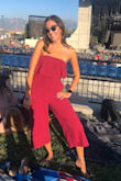 This jumpsuit is amazing! It's so comfy and flowy. I wore it to an outdoor concert where I was sitting on the ground most of the time and it wasn't restricting at all. I will say the top is a little loose on me because I have a small bust but it stayed up the whole concert so it wasn't a problem. - Emily P.