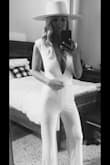 This white jumpsuit is the perfect addition to your closet. It's sexy but comfortable. The material is stretchy and has a lot of give. The only thing is make sure you have some double sided tape to avoid an unwanted slips. Highly recommend! - Whitney W.