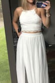 The dress is beautiful, light, just as expected. The only problems I had is it's a little loose for my small chested self. Also it's a little too long, even with 4 inch heels. 

Also I wasn't expecting to submit this picture so it's not the greatest. - Amber A.