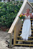 I wore this dress for my recent beach wedding. It fit like a glove and the quality was exceptional. I did have to have the hem taken up because I wore flats. It was stunning and I received many compliments on how beautiful it was. ook my fiances breath away when he saw me in it! - Terri B.
