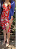 I love this dress! It is so comfortable! I have large hips and a large butt and this dress flowed perfectly from a fitted top to drape flowy and flattering over my bottom half. The slit is very flattering and not too high. I wore this to church on Easter Sunday with a blue cardigan and tan pumps and received a lot of compliments. I think a neutral cardigan or jacket would also pair well with it. I also have this dress in blue and in yellow, and the red fits me the best even though they are all the same size. I would size down if you are on the smaller side. Would recommend this beautiful dress to all! - Ashley C.