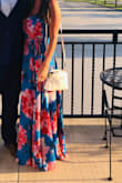 Wore this to an Indian wedding in August - bright colors were a must so this dress was perfect! It is a LOT of fabric in the skirt so there was NO leg slit as pictured in the model photo. Adjustable straps helped. I added a second clasp as backup on the chest, but good amount of coverage there for bigger boobs. Size didn't matter otherwise Bc it's a wrap dress. If I could I'd wear this to work all the time. It just makes you feel good! - Rachel G.