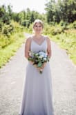 Had to get a hem & darts in the bust to make it smaller (always an issue for me with a smaller chest). But the waist was perfect size and the straps were adjustable. Wore as a bridesmaids dress for my sisters wedding and received lots of compliments! - Evelyn W.