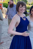 I wore this to a wedding in Portugal and got lots of compliments. There is a lot of material, but it is still flowy. This dress doesn't come down as far in the back on me as it did in the picture but still ok. I'm short so I had to have it hemmed. Turns out the bride brought the exact dress in hunter green to wear for her engagement/pre-wedding photos! She looked amazing in it, too. She is even more petite than I am, so even if you are small in stature, you can hem it to make it work! - Jennifer G.