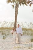 I bought this for my wedding. I am short and have small arms and shoulders. I would say this dress fits true to size. I had it altered in the length and the top straps, but that's just because I'm short and tiny. I expected to. The dress held up to alterations perfectly, lasted through the ocean and was exactly what I wanted! - Shelbi W.