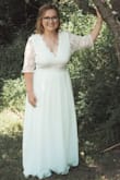 I had the sleeves altered into half sleeves, shortened the front of the dress for a sort of high/low affect, and tightened some around the waist. The dress was perfect and gorgeous. I was comfortable all day long and felt like a queen. The back of the dress was amazing too!! Very quick shipping and the online chat was EXTREMELY helpful. - Kayla G.