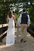 I am not the ball gown type so I struggled to find a dress for my wedding day but this one was perfect! It has that fun boho romantic feel that I love. The adjustable straps seemed to slip down on me so I ended up sewing on some beaded straps instead. I wanted the straps nice and tight for good coverage on top. I have minimal sewing experience but this was a super easy task. Also sewed some buttons on the lower seam so that I could bring up the train for dancing later in the night. I tried on a small which fit great in the waist, hips, and length but didn't quite work up top. I was very happy with the medium though and returning the small was a painless process :) - Valerie Z.