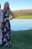 This dress is amazing and so flattering! I was worried about the length but it was perfect and I even wore small heels with it. Slit is not too high either. Love that you can tighten the top as much as needed. Got a ton of compliments! - Taylor M.