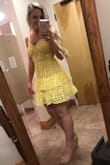 I love this dress!! I wore it to a "garden party attire" wedding and it was perfect with my nude wedges!! I wore a sticky strapless bra underneath but honestly you could definitely get away with just the sticker petals if you didn't want the push up. The yellow crochet is thick so it's a little heavy and won't blow around but still is nice and cool!! 10/10 would recommend!! - Elisabeth R.