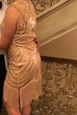Bought this dress for a 1920s themed party and it was perfect! It was a bit short but the tassels make it appear longer than it actually is. Fit a bit loose in the stomach area, but it doesn't take away from the shape of the dress. Overall, very comfortable! - Izzy J.