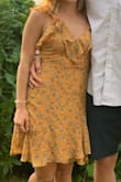 Super cute and flattering! I love the open back and ruffles at the busy. No need for bra. - Shannon D.