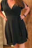 I ordered this dress primarily b/c it states it's emerald. It is NOT emerald. This is a hunter green dress. I was very disappointed. 
I do like the style of the dress-it's very pretty. However the cut in the chest is a bit off. I ordered a medium and a large. I thought the large would have a bit more coverage but I kept have to re-adjust and finally used a safety pin to keep it from exposing myself. I don't mind a low cut line but this was a bit much for me. - Suzanne B.
