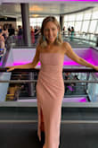 This dress is comfortable and very glam! I love the color but was initially nervous it would wash me out or blend in with my skin tone. Luckily I wore it at the end of summer and had a nice tan going. The cinching around the waist is very flattering and the slit made it easy to walk in. There is a little sticky strip on the inside of the top so that the dress stays up without straps. It was a little long so I had the bottom hemmed. Very happy with the dress. It was a big hit. - Erin S.