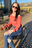 I highly recommend this off the shoulder top. I have owned many off the shoulder sweaters that ride up, this does NOT. Perfect for early fall, It is light weight while still being warm. One of my favorite Lulus purchases. - Nicole M.