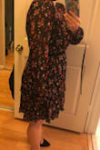 This dress is really cute.  It's a good length, the print is lovely.  The bust area actually works for me, even though I have a large chest.  The only negative is the sleeves are really long.  I thought the sleeves would have elastic around the wrist but it doesn't and so the sleeves hang past my finger tips.  If I keep this, I will have to get the sleeves altered.  If there was a button or elastic at the wrist, the sleeves would be better. - Tiffany G.