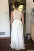 I'm going to wear this dress to my rehearsal dinner. It is so beautiful, even more so in person. The only negative thing I have to say about this dress is the neck line doesn't want to stay centered so it looks a little lopsided is you don't adjust it right. - Emily G.