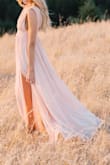 Love this dress! I wore it for my engagement photos to capture the dreamy and romantic look. It did perfectly and fit great! I got the shoulder hemmed to fit a bit tighter but could have left as is if needed. Being petite it's hard finding a long flowy dress. This dress gave me shape (fitted in all the right places). Would 10/10 recommend! - Kayli G.
