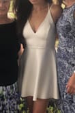 I bought this dress for my bridal shower, and I loved it so much that I ended up wearing it again for my rehearsal dinner. The back of this dress is so unique and the dress itself is so comfortable!! My only complaint is how hard it was to find a bra to go with this dress- I ended up going without. - Susan P.