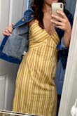 I initially bought this dress to wear on vacation, but didn't get to it - so now it's almost fall and I paired it with a jean jacket. So now it's versatile LOL. I'm 5'6 and 34A about 130 lbs. I ordered a small - fits perfectly after adjusting the straps. Material does wrinkle easily. - Megan V.