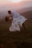 I loved this dress! We took our engagement photos on the top of a mountain on the blue ridge parkway on the border of Tennessee and North Carolina. I wanted a float dreamy dress and that's what I got. This dress is a wrap dress. It's a bit heavy and double lines. The material is really good quality - Hallie B.