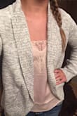 I love this, feels good and fits true to size (technically I am a 33 bust) and went with the small. Only things I don't like is that it's a little too short on me and the lace on the front curls down. - Ashton S.