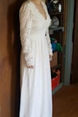 I ordered this dress and it said it would be here on 10/03. It arrived on 9/27! Other than the great delivery time, this dress fits very well. It is a little long, and the sleeves are a little loose and a little long, but other than that it fits me very well! I'll be wearing it as my wedding dress in December and I couldn't be happier with it! - Abigail A.