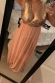 I love this dress! I got many compliments! The bust is a little snug, but I am top heavy so very understandable. I would definitely buy again! I ordered a large because XL was out of stock. It worked, but again since I'm larger on top, I would do the XL next time. - Jasmine B.