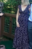 I wore this dress to a wedding and it was perfect! A little lower cut, but fit very well & never had to worry about anything falling out, even while dancing away! Fits true to size, fitted up top, more flowy below. Very happy with it!! - Lydia S.
