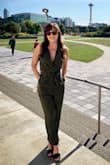 This is a very pretty jumpsuit that fits a little snug but I wouldn't return it. The top portion is a little loose which if you bend down could show more than you want but it's very versatile! - Alexis S.