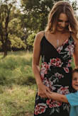 Love this dress! Used it for a mommy and son photo shoot and plan on using it for engagement photos! It does run a smidge large, but it's a wrap dress so it can be fixed. Probably would've ordered a size smaller! - Sarah B.