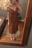 I am typically an XS in everything. The dress fits fine but I noticed the it is slightly tight against the hips. I definitely do not have large hips but you'd almost need to have no hips for it to fit perfectly. I do wish I sized up but I'm okay with the issue and will still be wearing it to a wedding. I'd recommend no underwear or something that is seamless underneath due to the nature of satin fabric showing everything and the tightness at the hip. Thankfully I have a seamless body shaper that is undetectable. Straps and wrap are adjustable as well. Color is beautiful! - Nicole R.