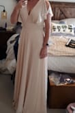 Lovely flowing dress and pretty color. Lenth will have to be altered and the v cut brought in as well but all and all I'm happy with it. - Phaer B.
