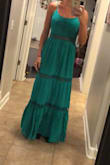 It is such an amazing color, fit and the material is fabulous. You will not be disappointed with this number. I was able to get a size 8 and it fit perfectly. Not too snug in the bus and the length was great for someone who is tall - Cali W.
