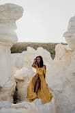 I ordered this dress for my birthday photo shoot and it was simply stunning. It fit great, is a vibrant color, the material is flowy and soft, there's a lot of movement in it and I love the shoulders. I received so many compliments! Definitely a great buy. I HIGHLY recommend! - Calandra A.