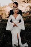 I wore this for some dramatic engagement photos and loved the way it turned out. I ordered the S and XS as I'm normally between sizes and the XS fit like a glove. I was barefoot and the length was perfect- so if you're 5'7" or taller heels are not an option or it may be too short! Super flattering and the cleavage wasn't too much at all. Very pleased! Would make a gorgeous wedding dress! - Hailey B.