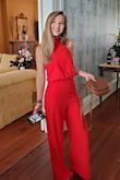 If you're contemplating getting this jumpsuit - just do it!! It is GORGEOUS! And super flattering. I did however have to get it hemmed at least 4 inches after trying it on even with heels. So if you're on the shorter end, already plan on getting it hemmed. The only down fall is that it's a teeeeny bit tight around the waist so it was a little uncomfortable when eating dinner, but other than that it was perfect. Highly recommend!! - Melissa S.