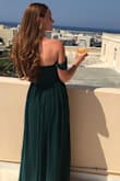 I wore this dress in Greece for a beautiful outdoor wedding. The green color is a nice emerald, and the bust area fit nicely. I did feel as though I needed to keep pulling up the bust area, but maybe that's because I'm a little self-conscious. I did get it hemmed to fit the length, but I do have very short legs in comparison to the length of my torso area. I wore comfy sandals underneath, but no one could see them anyway. It was easy to move around dance all night. - Alison G.