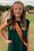 My daughter was a vision in green! Absolutely beautiful! We got many many compliments on this dress. It is well made and stunning in person. - Haley B.
