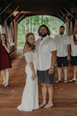 It turned out to be a beautiful, simple wedding dress! Fit was perfect, very flattering. Only complaint was it looked weird if you lifted your arms up, the drape part would flip up. - Sarah T.