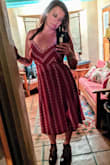 This dress is cute and stylish, it's very flattering for curves. Love the tie in the back, no bra needed and still contained my larger girls well. I also really like the two front thigh slits, very comfy to walk around for longer periods too. Lots of compliments! - Sylvia Z.