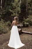 Wore this to our recent elopement in the mountains. The details were gorgeous & complemented the outdoors so well. 
I received sooo many compliments on how pretty it was!
I did have it altered a little to fit my back as the sides bulged out a little and we hemmed it a little bit. 
Completely satisfied and happy I didn't have to spend thousands of dollars on a wedding dress! - Madison V.