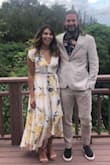 I wore this dress for a summer wedding in Hawaii. It fit perfectly and looked amazing. I got tons of compliments. I'm 5ft 4in and i was worried it might be too long for me. But I wore it just with 2 inch heels and it looked amazing. The neckline is little deep but I bought the fashion tape from lulus (link below) and it kept the neckline in place. I highly recommend this dress. 
https://www.lulus.com/products/hollywood-fashion-tape/180170.html - Roshni S.