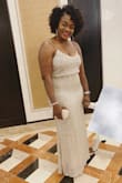 Fits well. Flattering I wore this dress to a wedding and I received tons of compliments. I also loved it because it's so comfortable, elegant and very long. - Stephanie J.